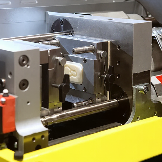 Metaplex injection molding production using industrial molding machines to create custom plastic parts with precision tooling and advanced polymer materials.